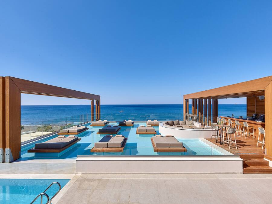 Seasonal outdoor pool, open 8:30 AM to 7:00 PM, pool umbrellas