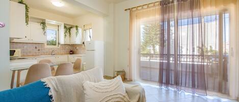 Apartment, 1 Bedroom | Living area | Flat-screen TV