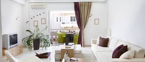 Apartment, 2 Bedrooms | Living room | Flat-screen TV
