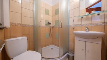 Shower, designer toiletries, towels