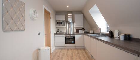 Apartment, 2 Bedrooms | Private kitchen | Mini-fridge, microwave, oven, stovetop