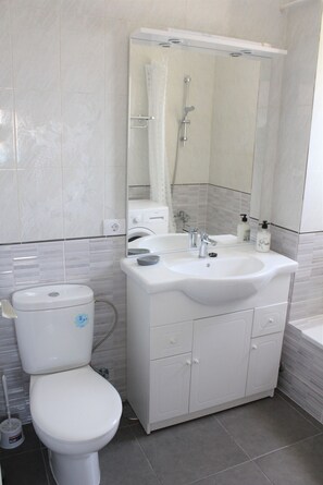 Bathtub, hair dryer, towels