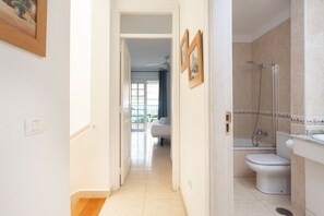 Bathtub, hair dryer, towels