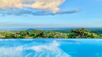 2 outdoor pools, open 8:00 AM to 9:00 PM, pool umbrellas, pool loungers