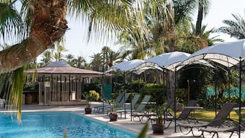 Outdoor pool, open 10:00 AM to 10:00 PM, pool umbrellas, sun loungers