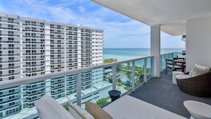 A balcony with a view of a high-rise building and the ocean. - Luxurious 3/3 Ocean View Condo 1107 - Located at 1 Hotel & Homes South Beach (Miami Beach)