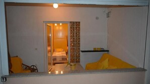 A small, compact room with a bed, a chair, and a table. - Apartment in Vrsi with Balcony, Air condition, WIFI (4824-3) (Vrsi)