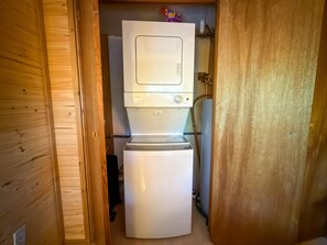 A compact kitchen with a built-in microwave and refrigerator. - Culps Cascade | Wi-Fi, Woodstove, Cedar Hot tub (Packwood)