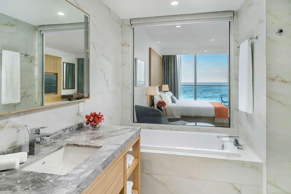 room, 1 king bed, balcony, oceanfront | bathroom | free toiletries, hair dryer, slippers, towels