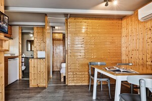 Family Bungalow, 2 Bedrooms, Kitchenette | Living area | 24-inch flat-screen TV with cable channels, TV