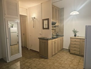 Fridge, coffee/tea maker, cookware/dishes/utensils