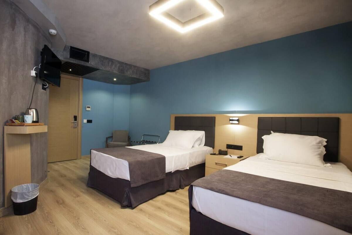 Family Room | Minibar, soundproofing, WiFi (free), bed sheets