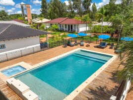 Outdoor pool, open 9:00 AM to 11:00 PM, sun loungers