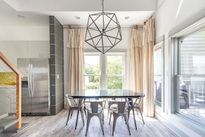 Dining Table, Chairs, Ceiling Lamp, Refrigerator, and Window Doors.