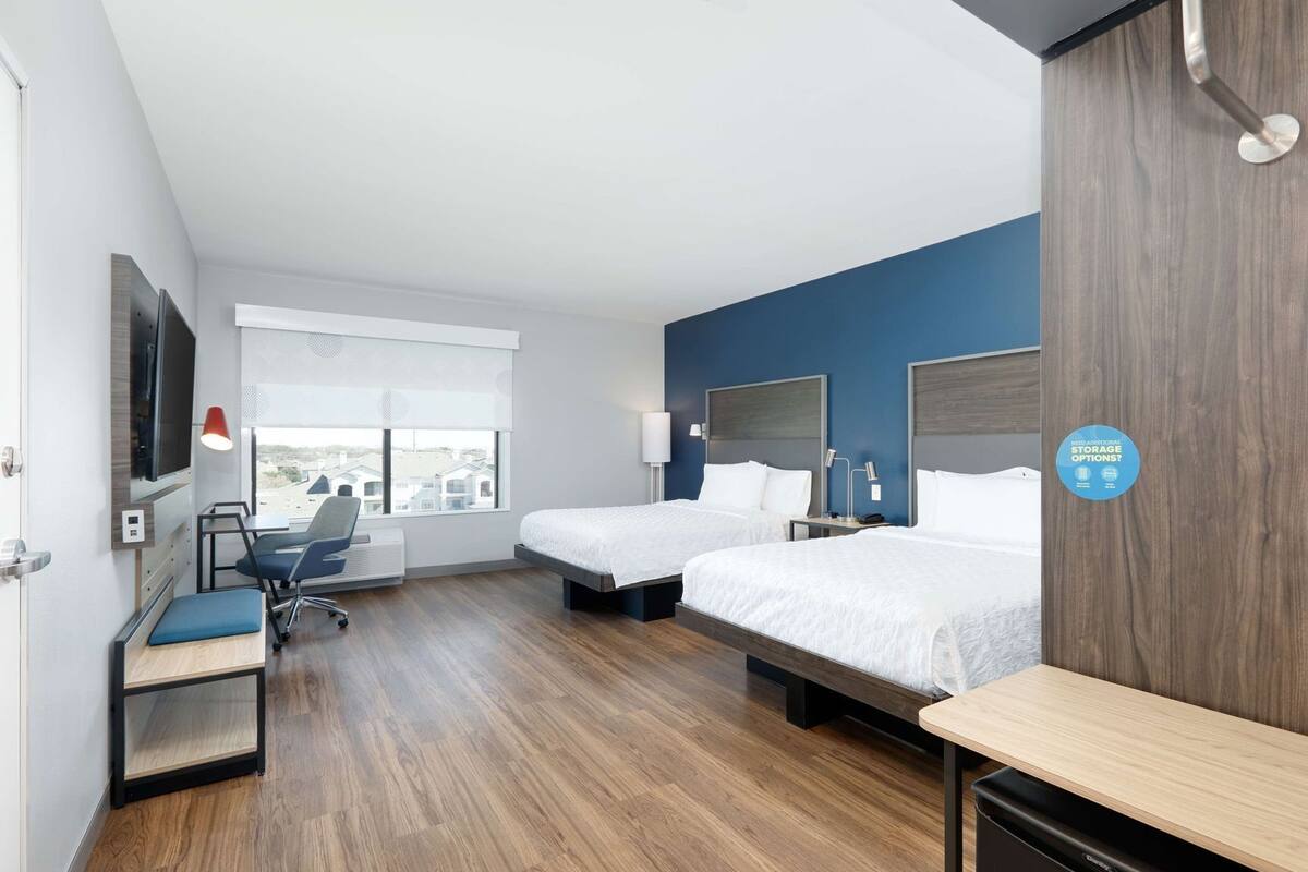 Hypo-allergenic bedding, desk, laptop workspace, blackout drapes