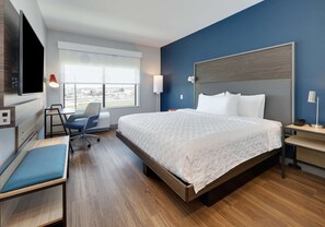 Hypo-allergenic bedding, desk, laptop workspace, blackout curtains