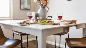 A dining table with a pitcher, glasses, and fruits. - Newly Renovated Sparkling Springs by J and Amy BL990802 (Mesquite)