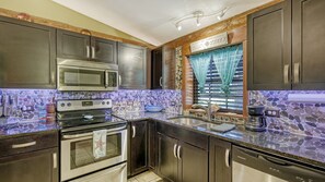 Microwave, dishwasher, coffee/tea maker, cookware/dishes/utensils