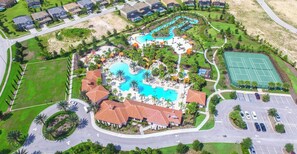 An aerial view of a resort with multiple swimming pools, a tennis court, and a parking area. - 5 Bedrooms / 4.5 Bathrooms / Solterra (4643 TD) (Davenport)