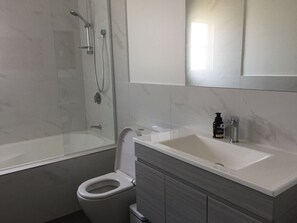 Combined shower/bathtub, towels - Swansea Lakeside Retreat is a large property on the shores of Lake Macquarie (Swansea)