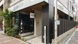 A building with a sign reading 'Rakuten Stay' and a reception area. - Rakuten STAY URBAN Shijo Kawaramachi (Kyoto)