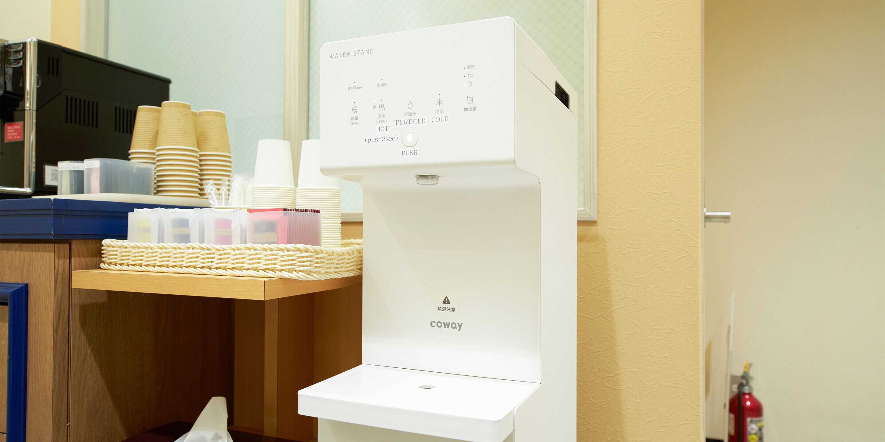 A water dispenser with multiple settings, including UV clean, hot, and purified water.