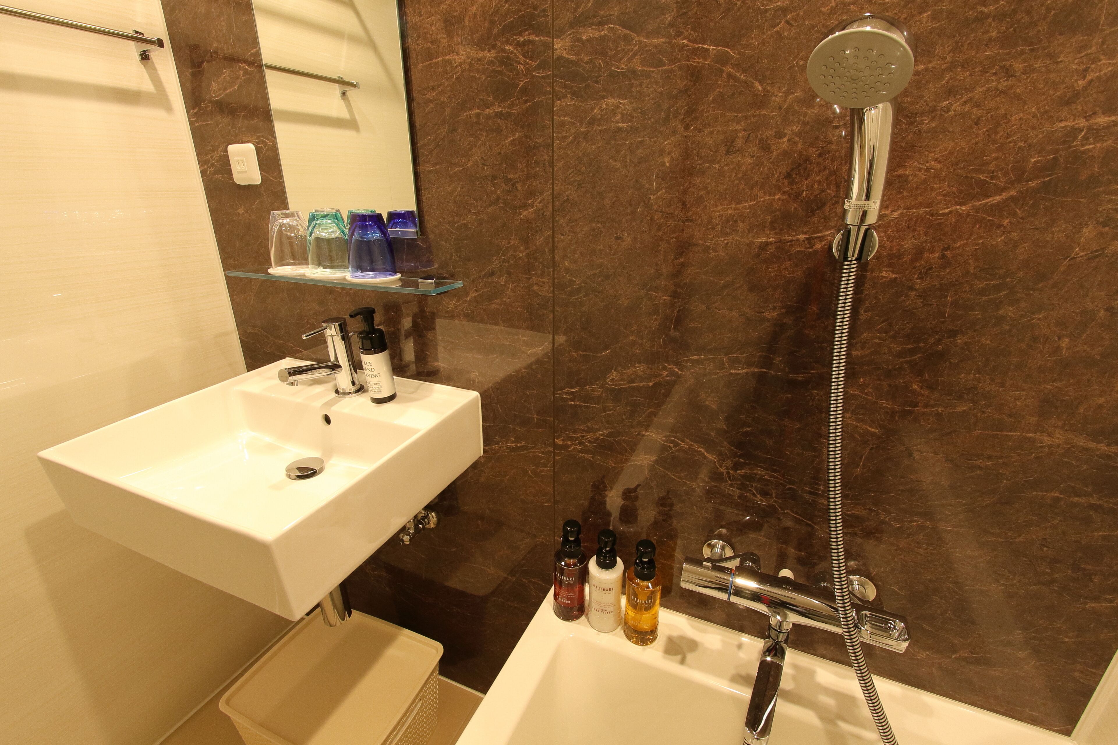 separate bathtub and shower, hair dryer, bathrobes, electronic bidet