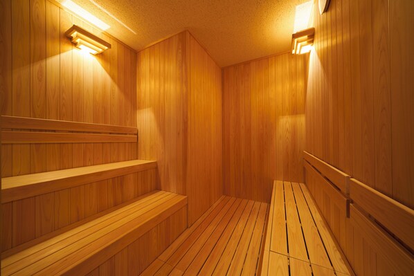 A wooden sauna with benches and wall-mounted lights. - Fujisan Mishima Tokyu Hotel (Mishima)