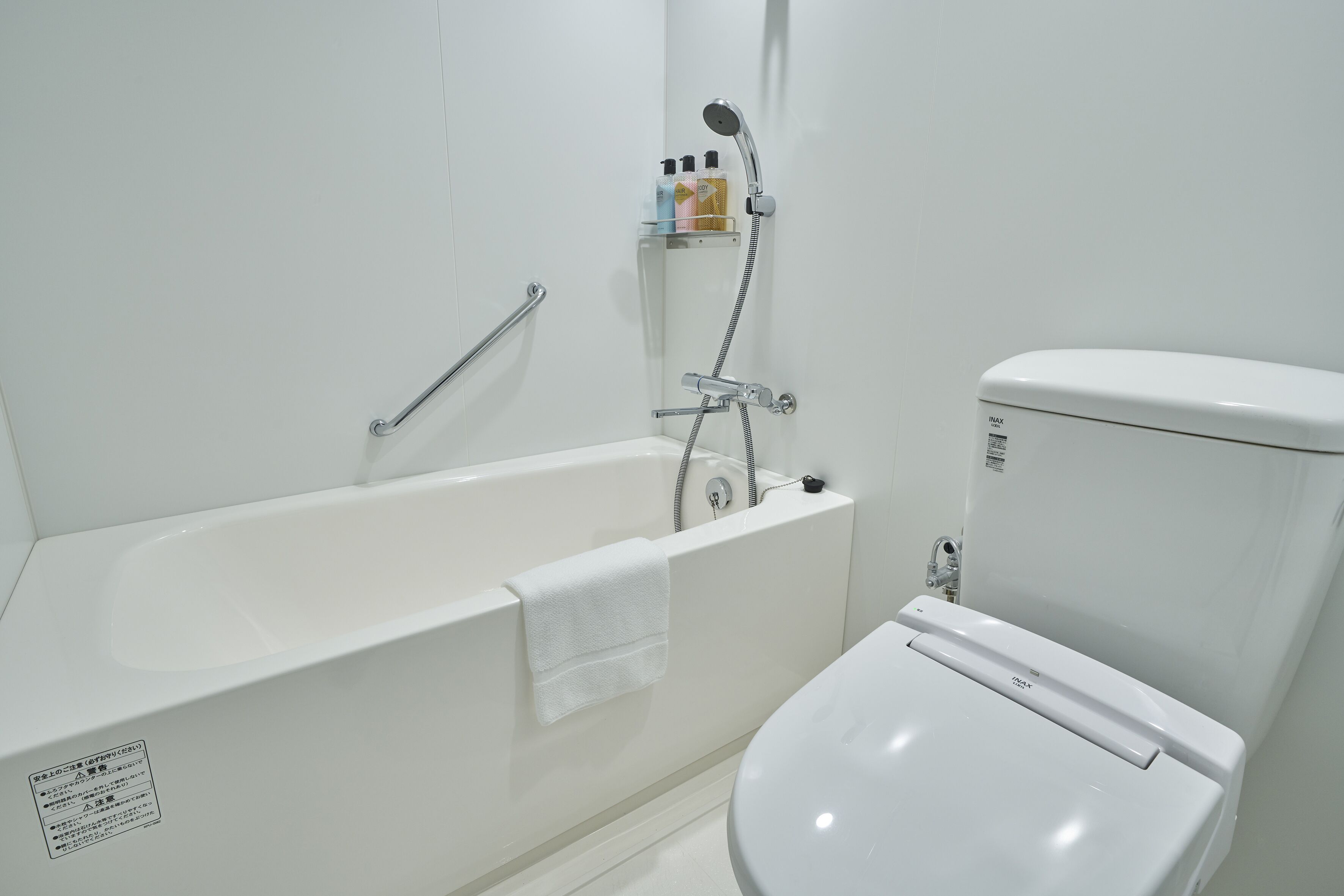 combined shower/bathtub, free toiletries, hair dryer, slippers