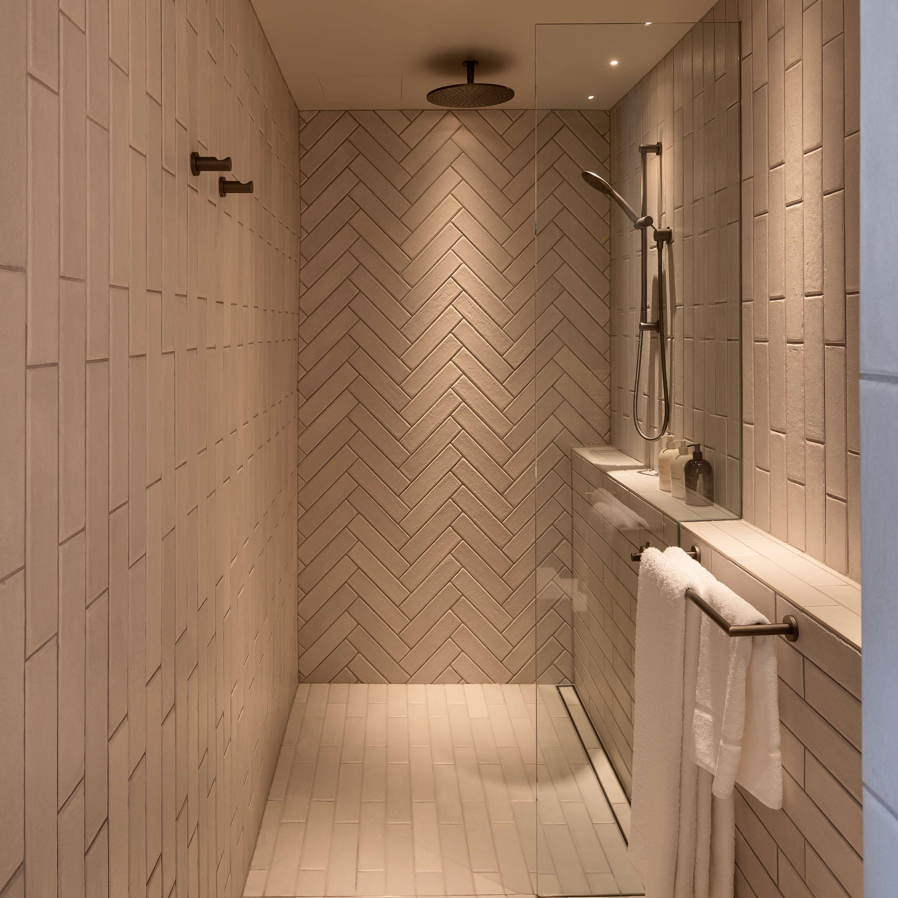 designer toiletries, hair dryer, bathrobes, slippers