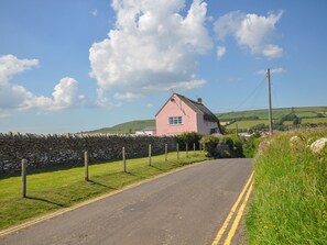 Escape to a serene countryside retreat surrounded by rolling hills and lush greenery.