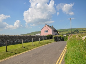 Escape to a serene countryside retreat surrounded by rolling hills and lush greenery.