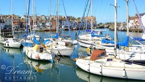 A marina with several sailboats docked. - Dream View (Weymouth)