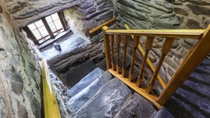A stone staircase with wooden railings leading to a lower level. - Cwm Yr Afon Mawr (Llanbedr)