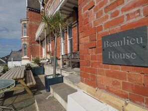A brick building with a sign reading "Beaulieu House." - Beaulieu House (Llandudno)