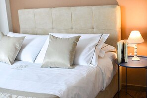 Premium bedding, desk, laptop workspace, soundproofing