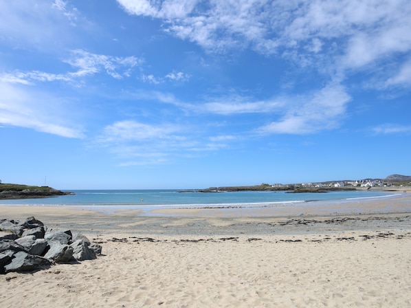 Enjoy a serene beach experience with access to the sandy shore and scenic views.