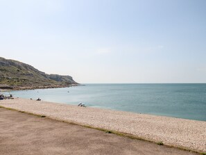 Enjoy a serene beach experience with access to the calm sea.
