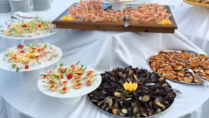 A buffet table with seafood dishes, including shrimp, mussels, and various salads. - Parco delle Stelle (Castelmauro)