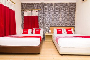 A hotel room with two beds, each with red and white bedding and pillows, a wooden nightstand, and a patterned wallpaper on the wall. - OYO 2097 Hotel Laksana Inn (Batam)