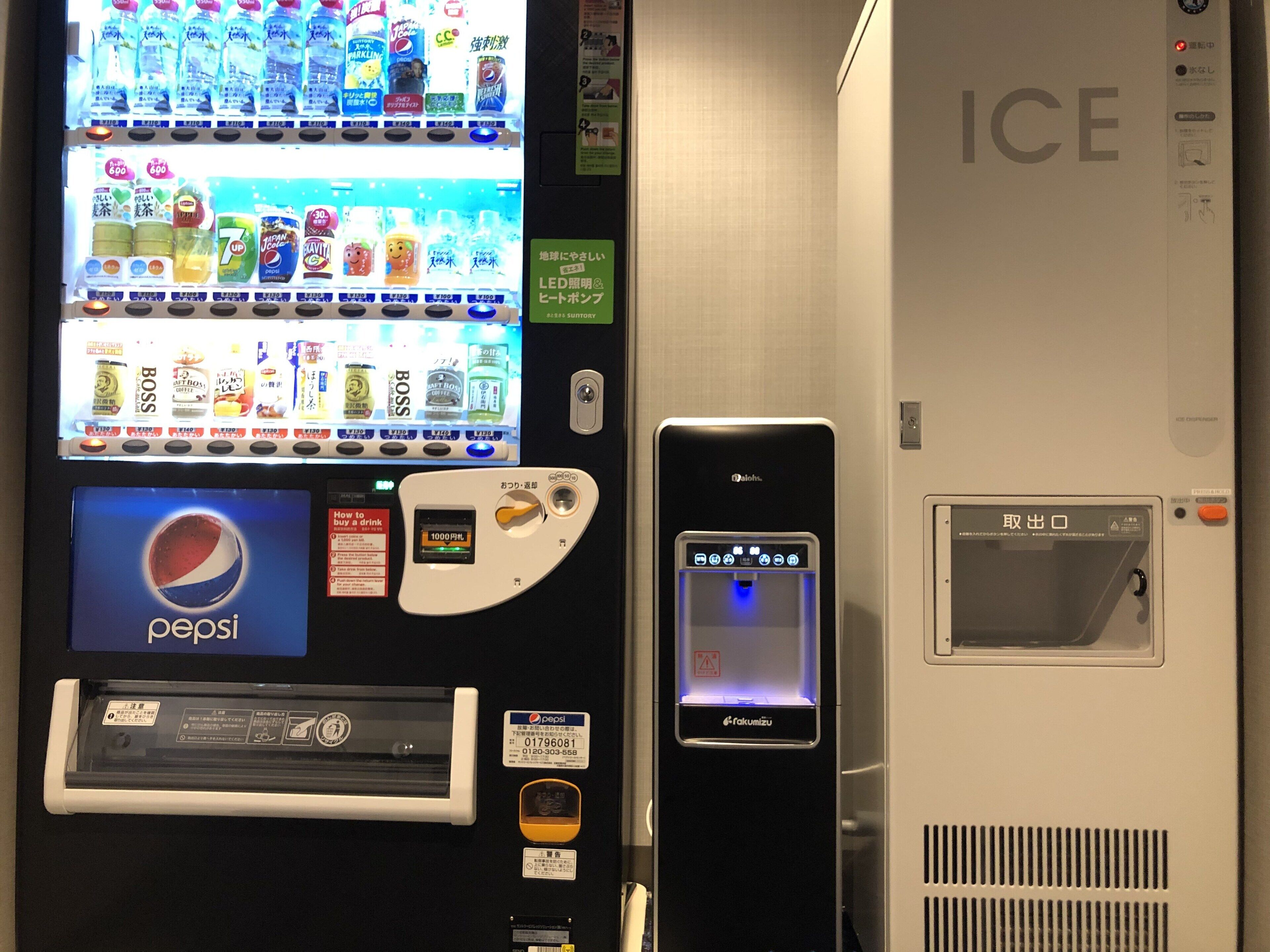 A vending machine with a Pepsi logo and a water dispenser.