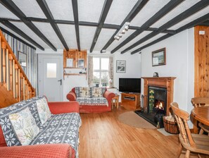 Cottage | Living area | TV, fireplace - Cae Person (Beaumaris)