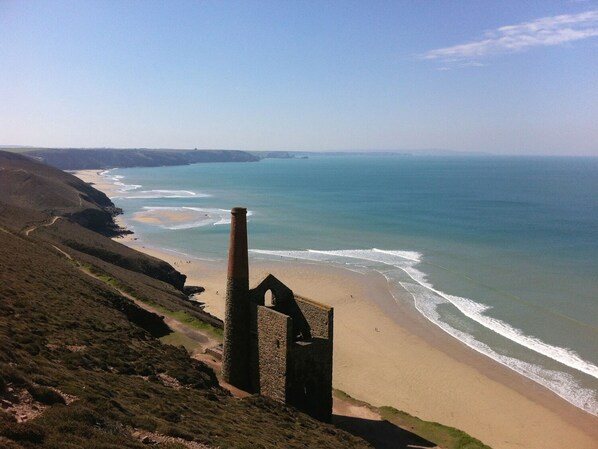 Explore a historic coastal ruin with breathtaking ocean views and beach access.