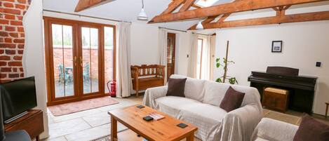 Ferienhaus | Wohnbereich | Fernseher