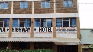 A building with signs for 'MAINA', 'HIGHWAY', and 'HOTEL'. - Maina Highway Hotel (Embu)
