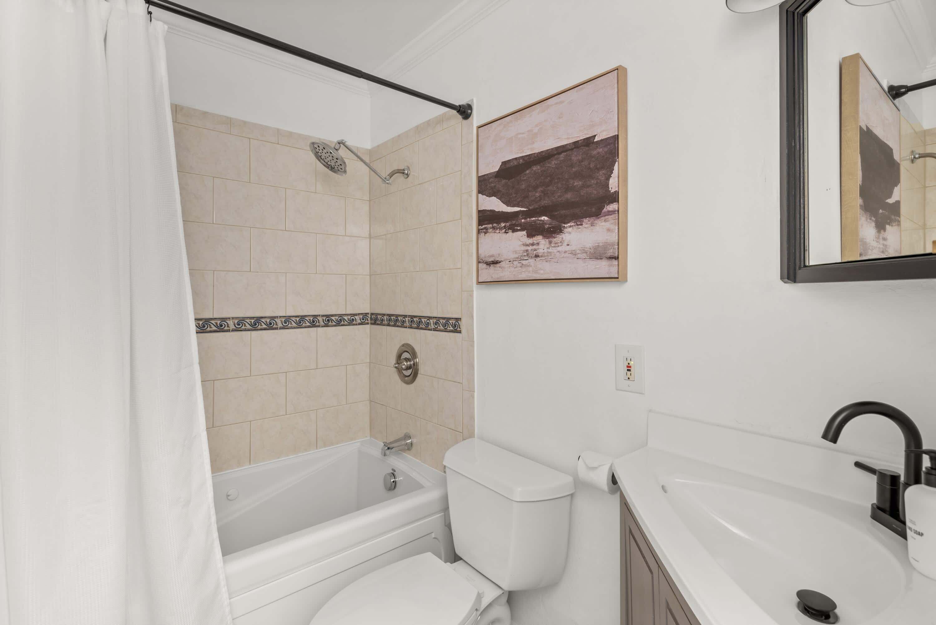 Bathtub, hair dryer, towels, soap