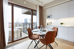 Luxury Apartment | Living area | 100-cm LCD TV with cable channels, TV