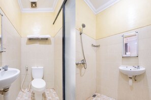 A bathroom with a toilet, sink, shower, and towel rack. - OYO 1700 Danurejan Guesthouse (Yogyakarta)