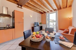 Deluxe Apartment, 1 Bedroom, City View, Tower | Dining room - Flowers Apartments (Desenzano del Garda)