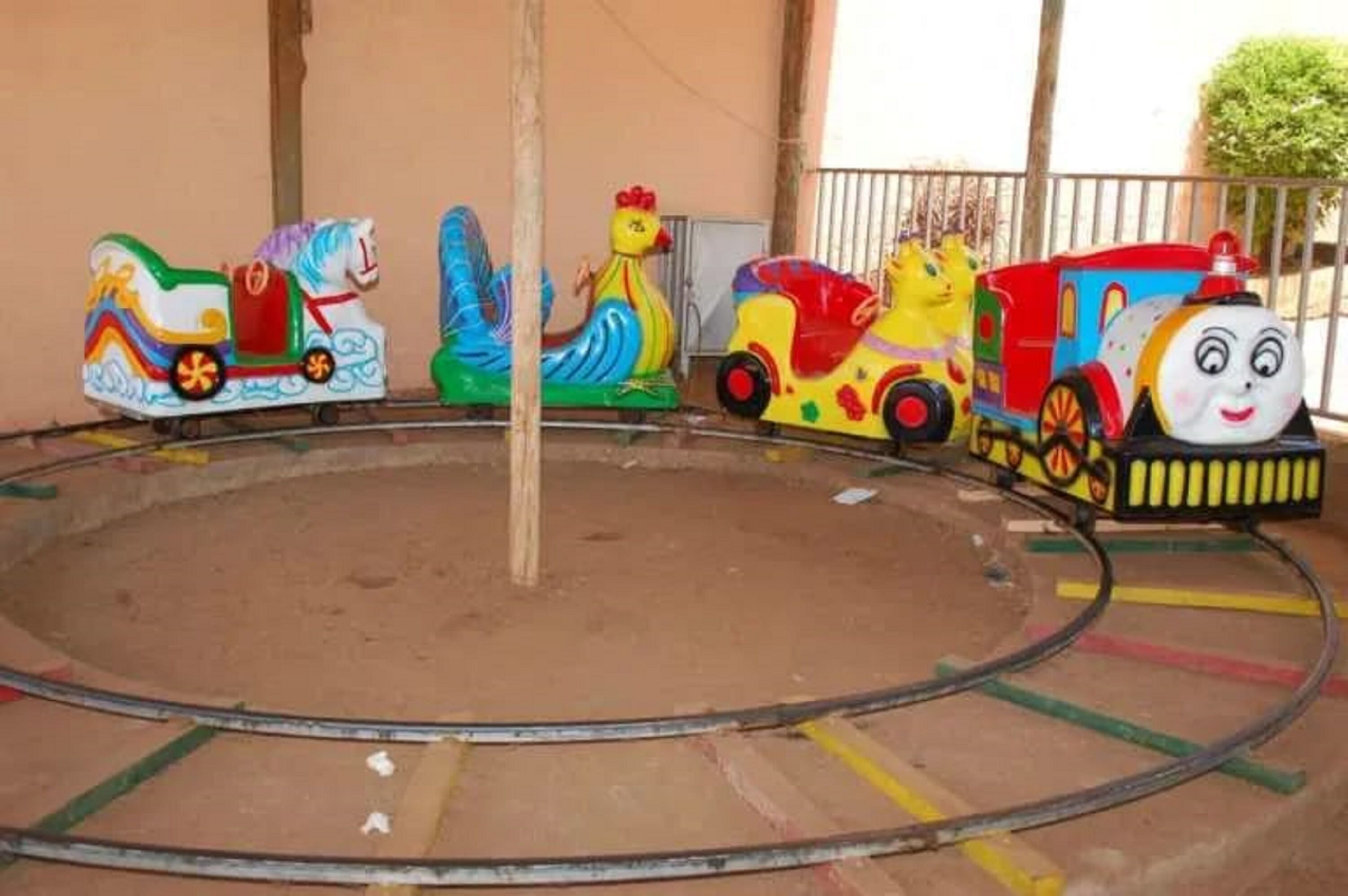 A colorful carousel with animal-shaped seats.